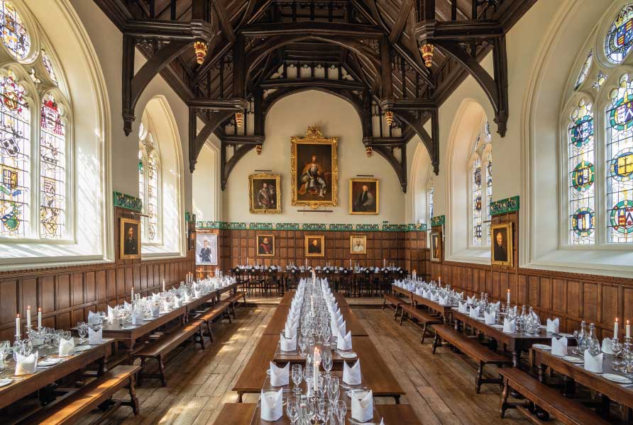 Photo of an historic dining hall with vaulted ceiliing and wooden panelling