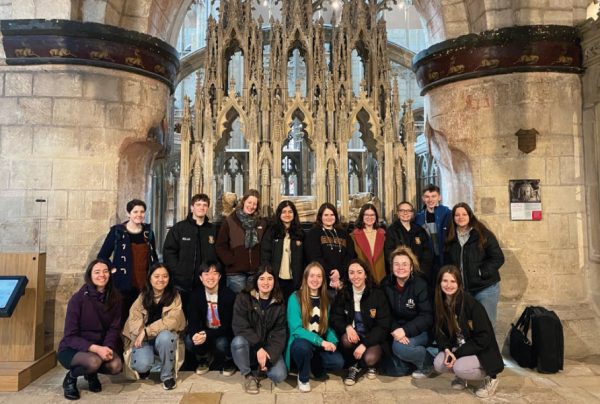 Photo of a group of students inside Gloucester Cathedral