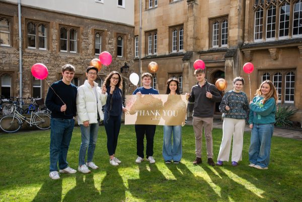 Students with a thank you sign