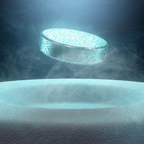 An example of superconductivity showing a magnet hovering above a metal