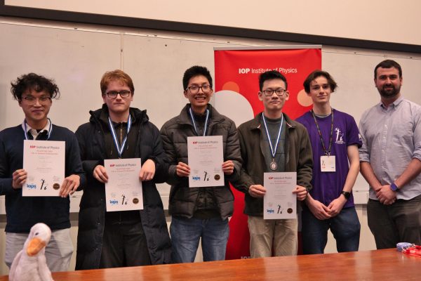 Students holding their second place certificates standing together