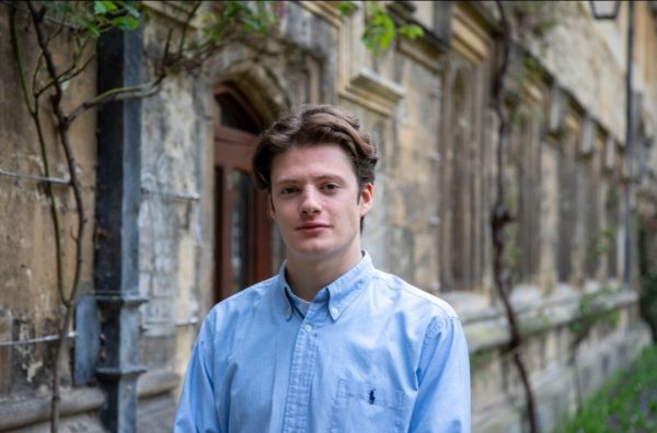 Alessandro in Oriel College wearing a light blue shirt